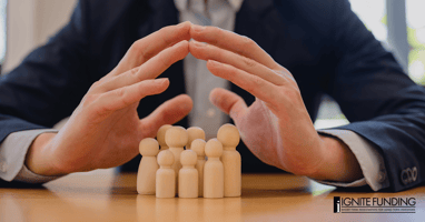 Hands covering group of wooden figures representing a certificate of trust verifying a trust while protecting the private details