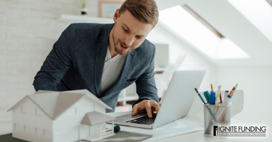 Man performing real estate underwriting evaluating the proposed project
